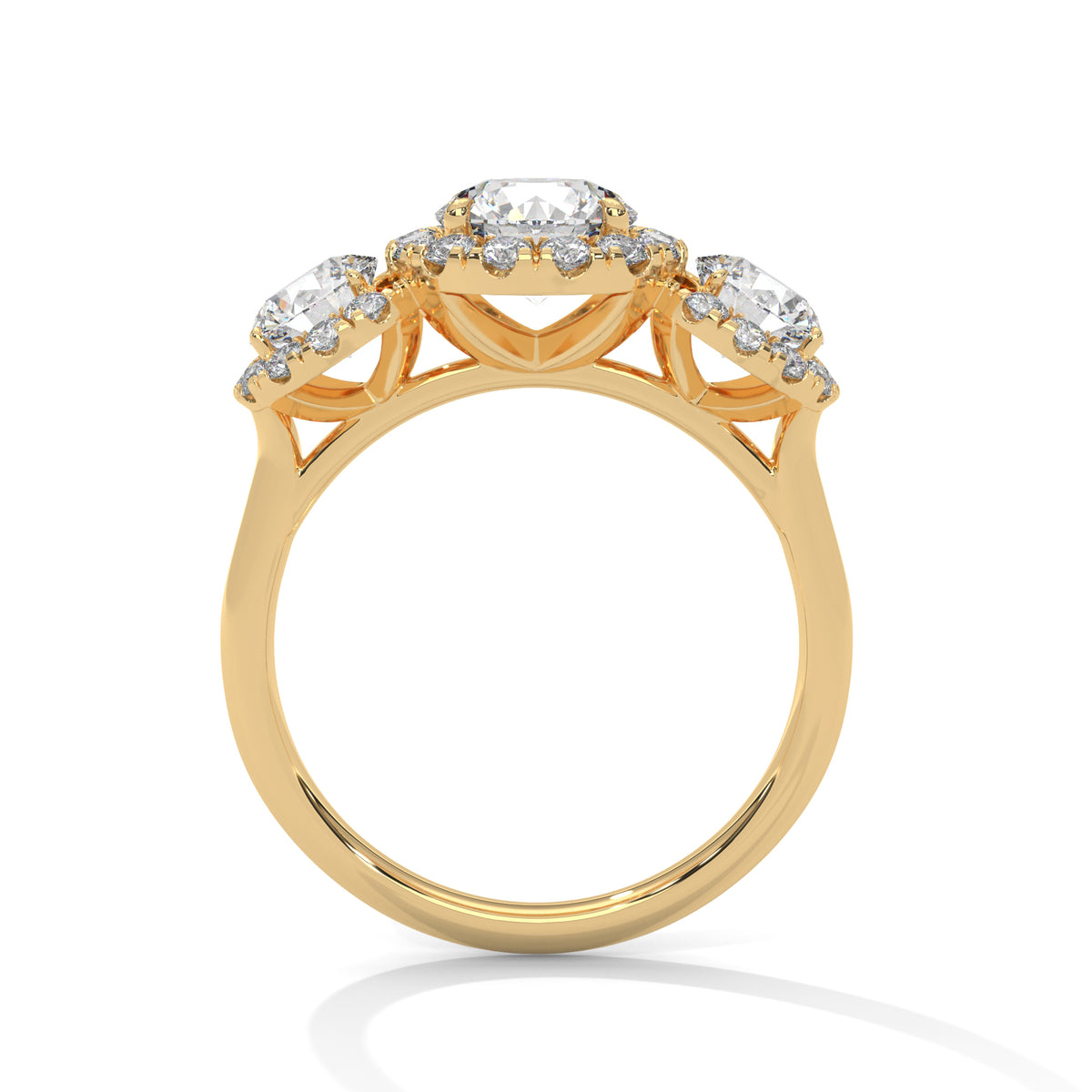 Side profile of a three-stone round cut diamond halo engagement ring in yellow gold with raised gallery settings.