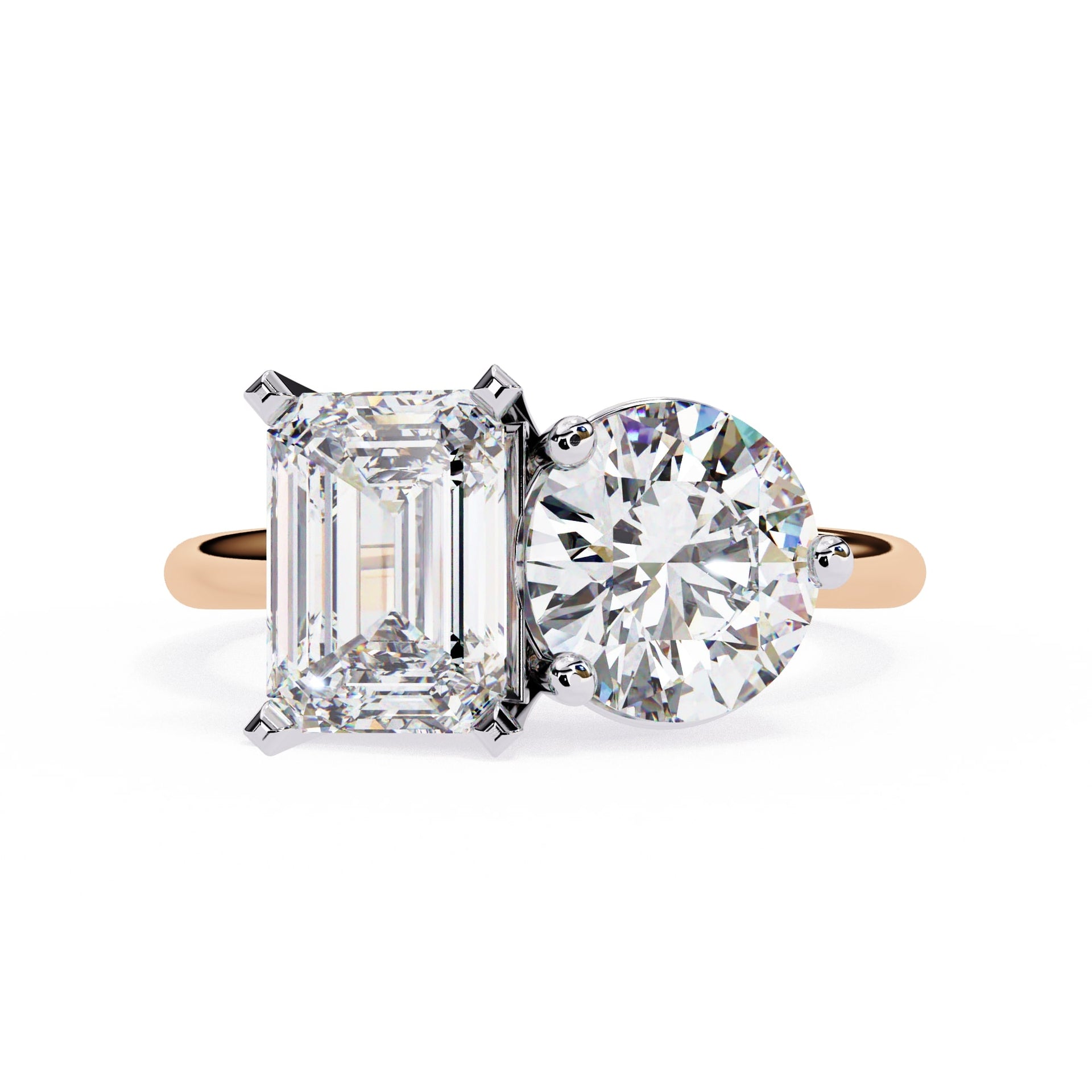 Diamond ring with emerald-cut and round-cut diamonds on a white background
