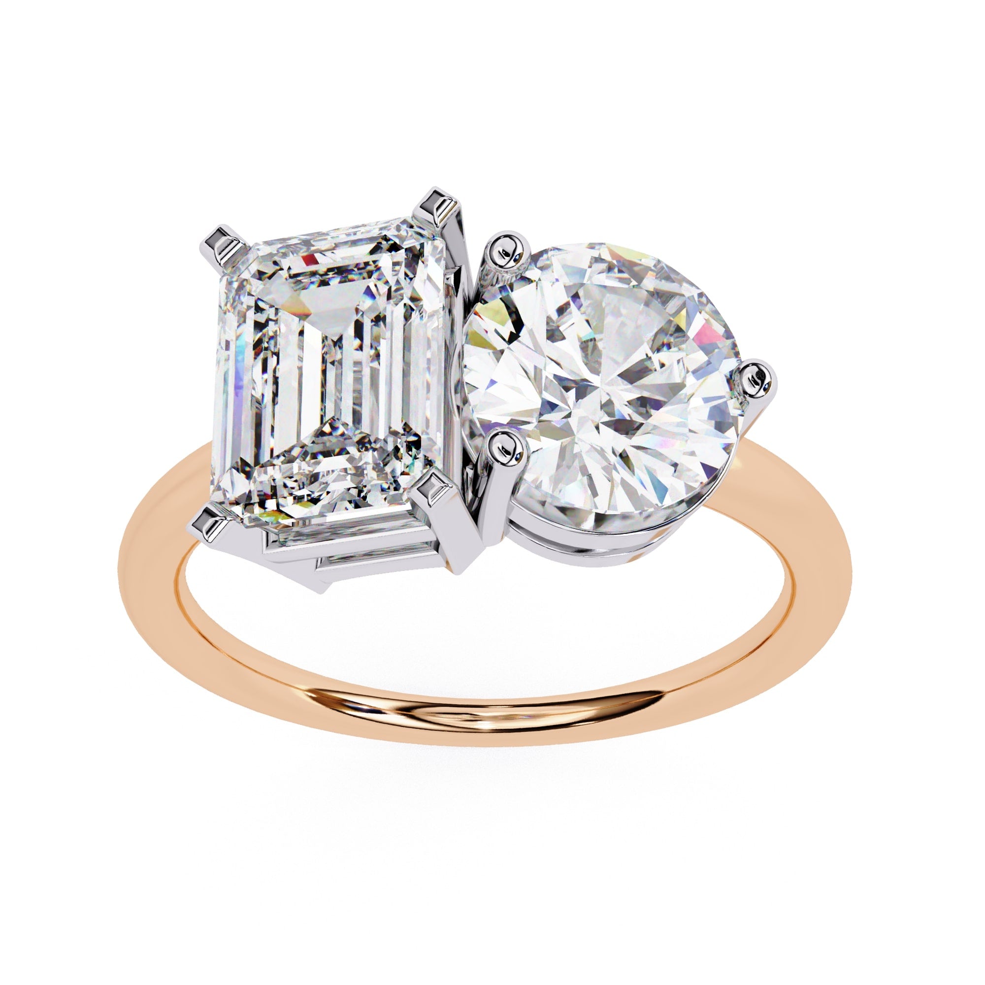 Two-stone diamond ring with emerald-cut and round-cut diamonds on a white background