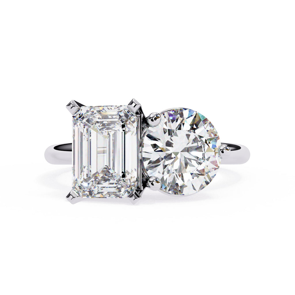 Diamond ring with two different cut diamonds on a white background
