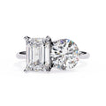 Diamond ring with two different cut diamonds on a white background