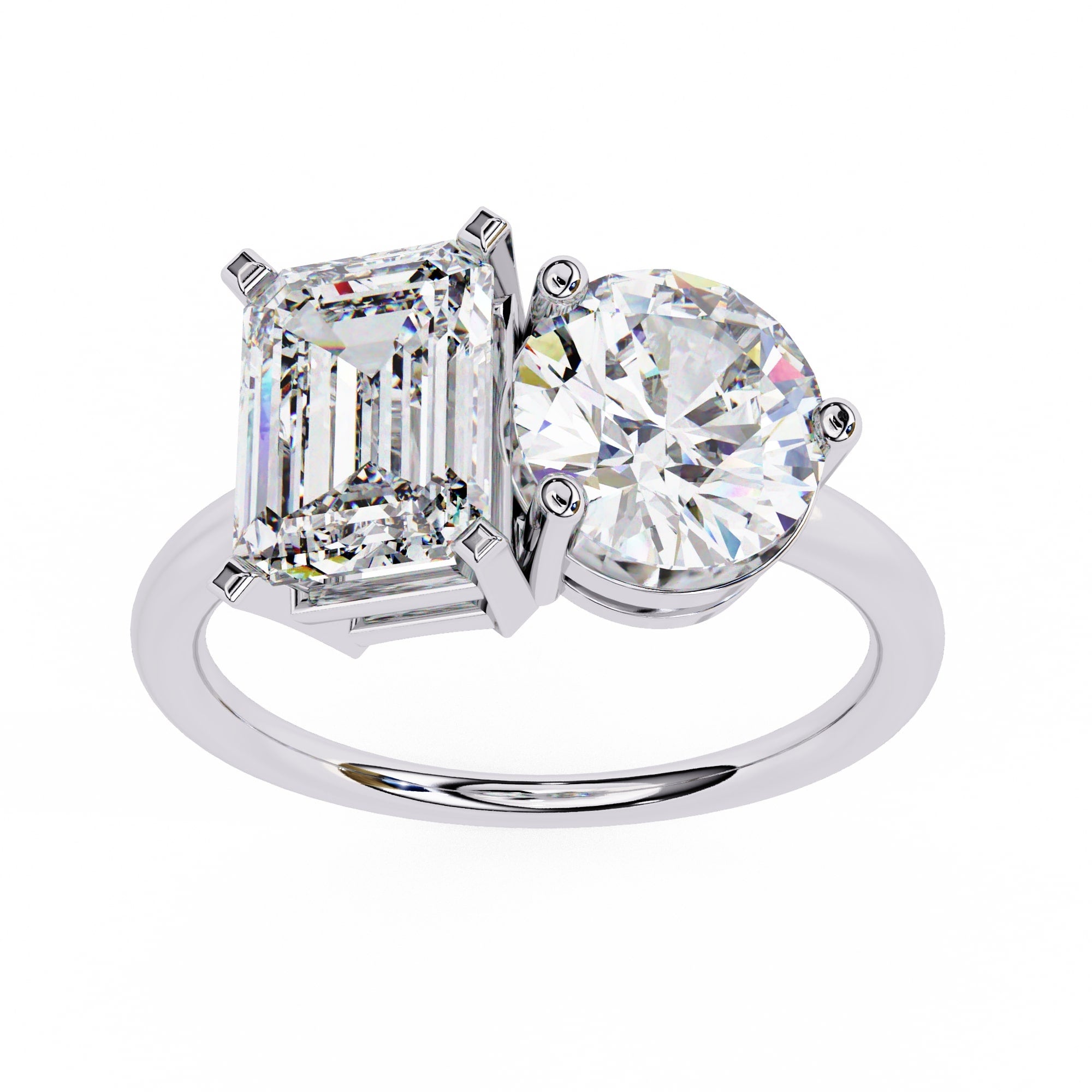 Diamond ring with two prominent gemstones on a white background