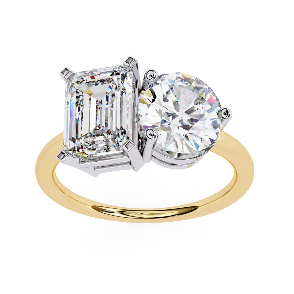 Gold ring with two diamonds on a white background