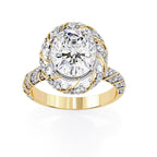 Gold ring with a large diamond and smaller diamonds on a white background